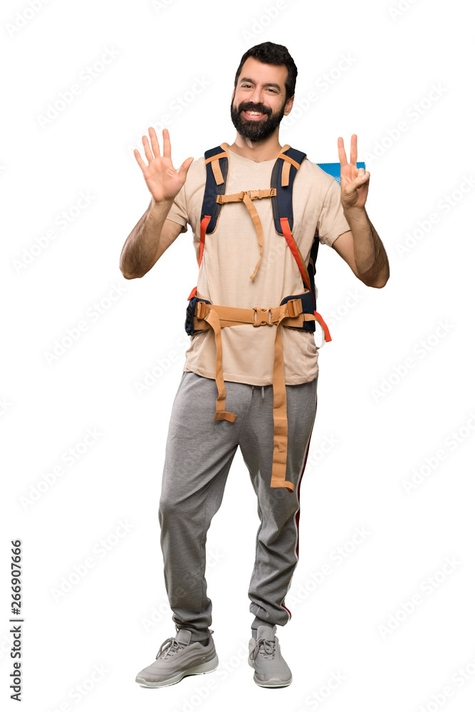 Hiker man counting seven with fingers over isolated white background Hiker man counting seven with fingers over isolated white background