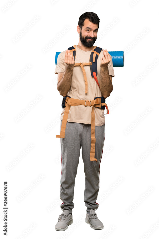 Hiker man making money gesture over isolated white background Hiker man making money gesture over isolated white background