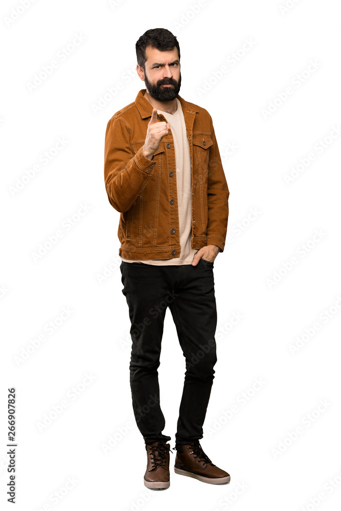 Handsome man with beard frustrated and pointing to the front over isolated white background Handsome man with beard frustrated and pointing to the front over isolated white background