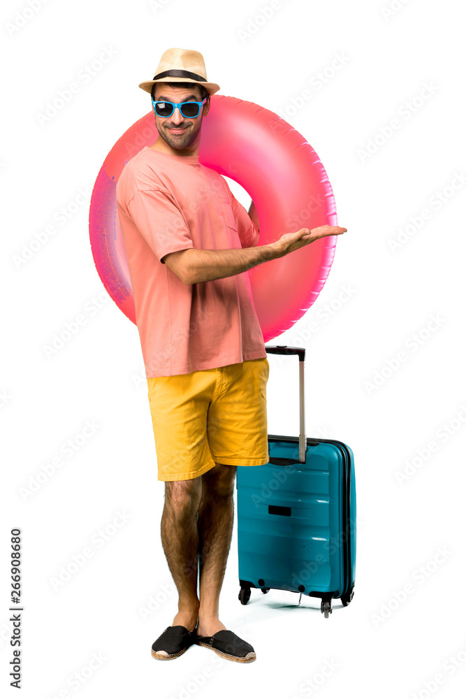 A full-length shot of Man with hat and sunglasses on his summer A full-length shot of Man with hat and sunglasses on his summer