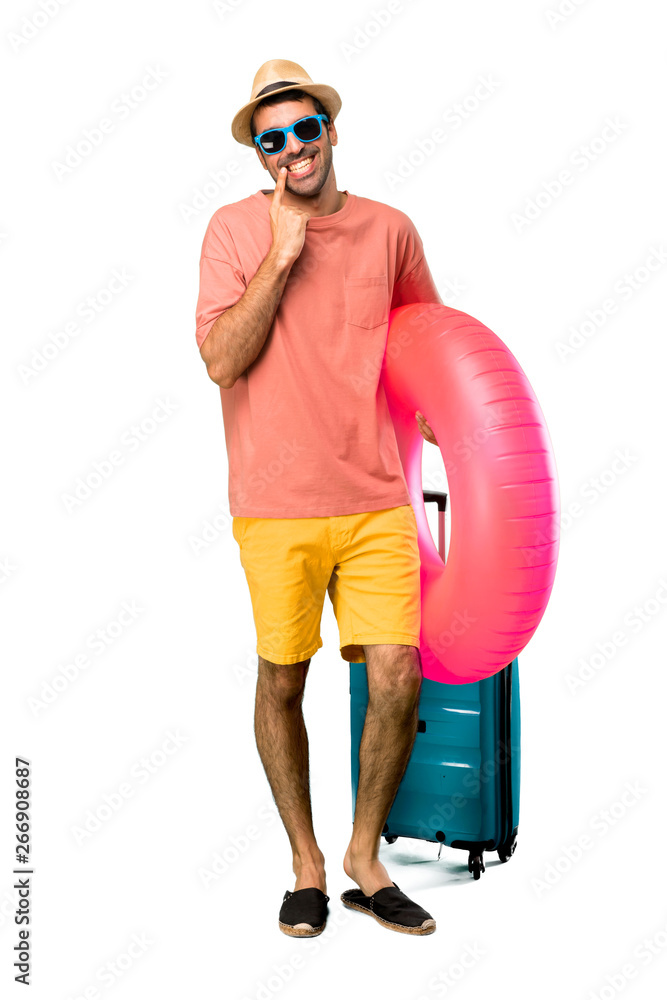A full-length shot of Man with hat and sunglasses on his summer A full-length shot of Man with hat and sunglasses on his summer