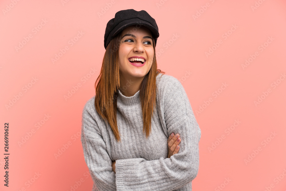 Fashion woman with hat over pink wall laughing Fashion woman with hat over pink wall laughing