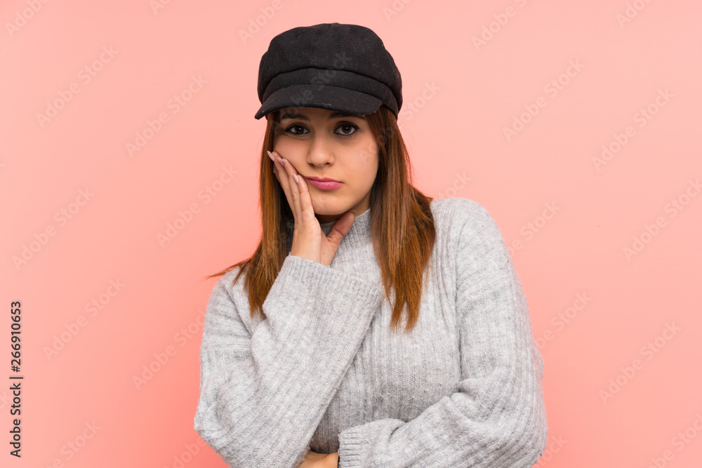 Fashion woman with hat over pink wall unhappy and frustrated Fashion woman with hat over pink wall unhappy and frustrated