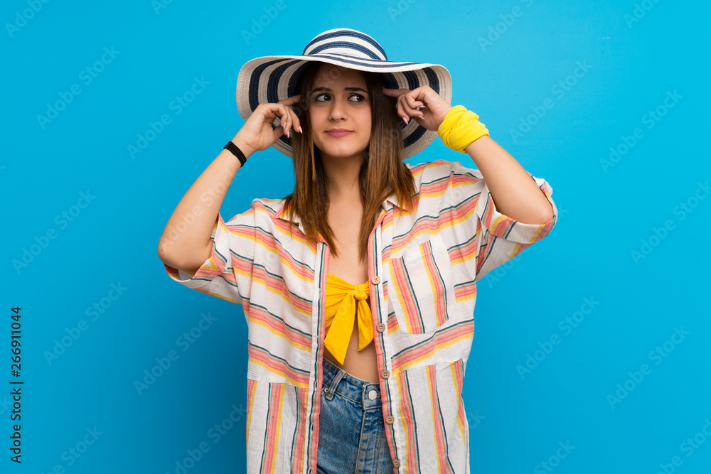 Young woman in bikini in summer holidays having doubts and thinking Young woman in bikini in summer holidays having doubts and thinking