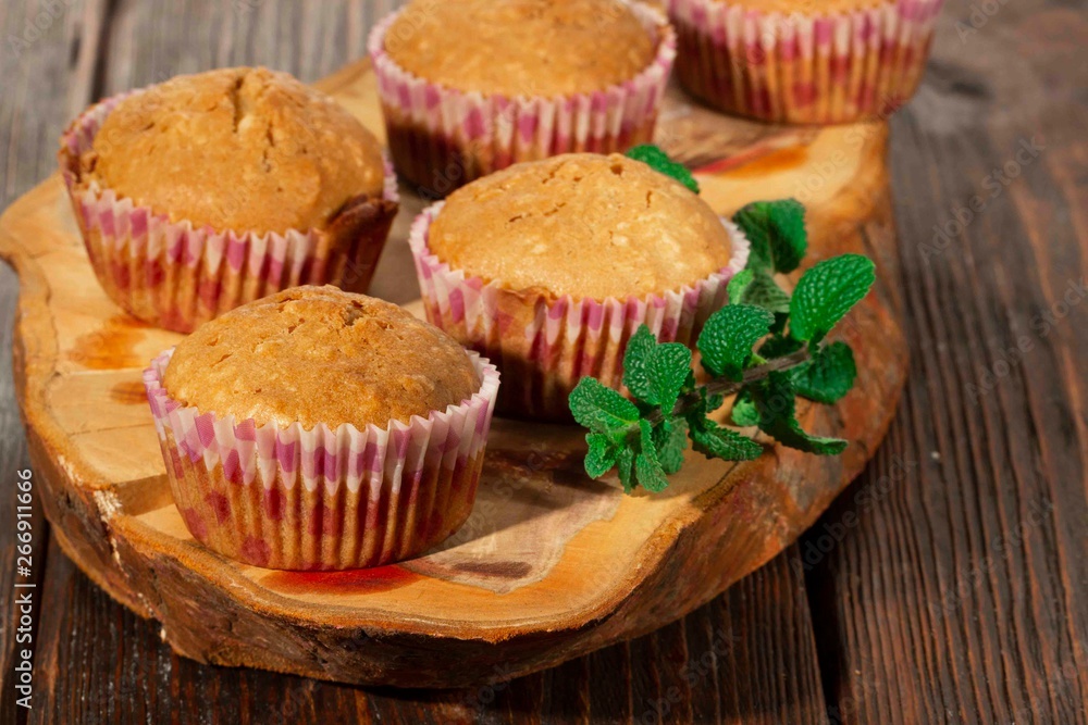 Vanilla cupcake, homemade pastry on wooden background Vanilla cupcake, homemade pastry on wooden background