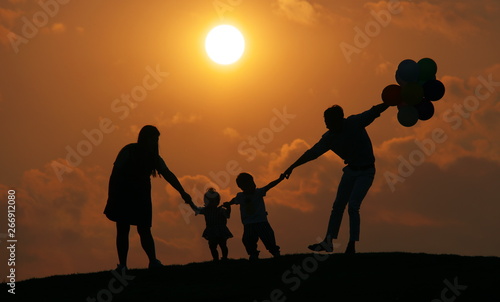 SILHOUETTE FAMILY AT SUNSET