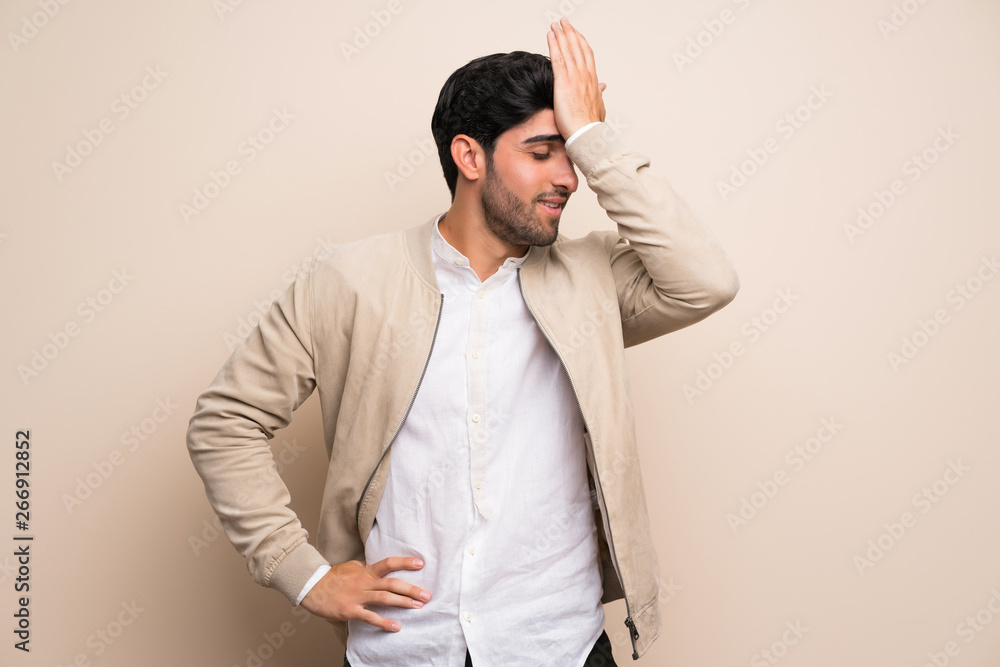 Young man over isolated wall has realized something and intending the solution Young man over isolated wall has realized something and intending the solution