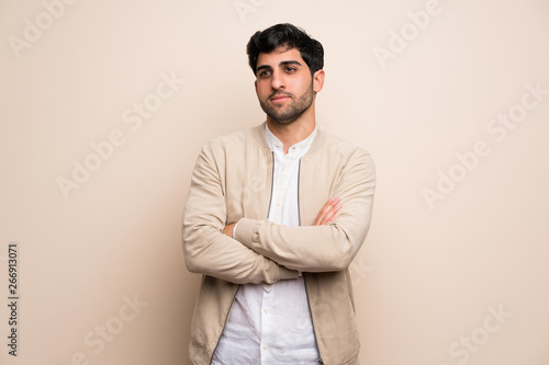 Young man over isolated wall portrait