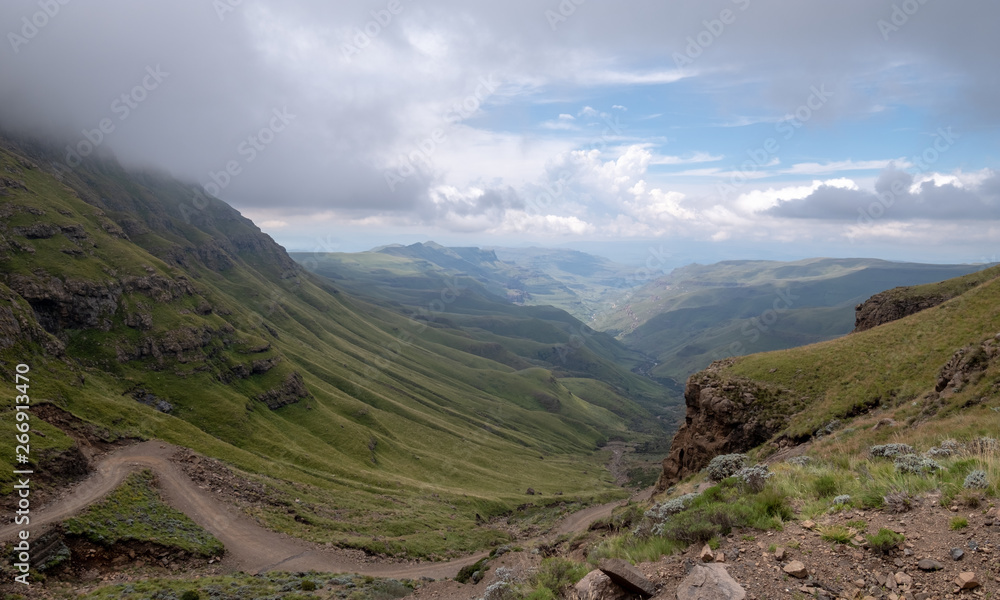 Fototapeta premium The Sani Pass, winding dirt road through the mountains connecting Underberg in South Africa to Mokhotlong in Lesotho. 