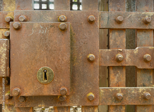 Old, rusty vintage jail cell lock outdoors in the Wild West USA