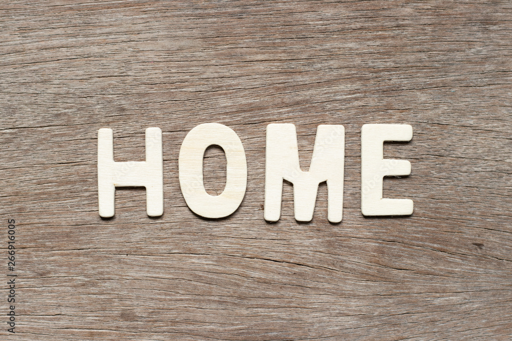Alphabet letter in word home on wood background Alphabet letter in word home on wood background