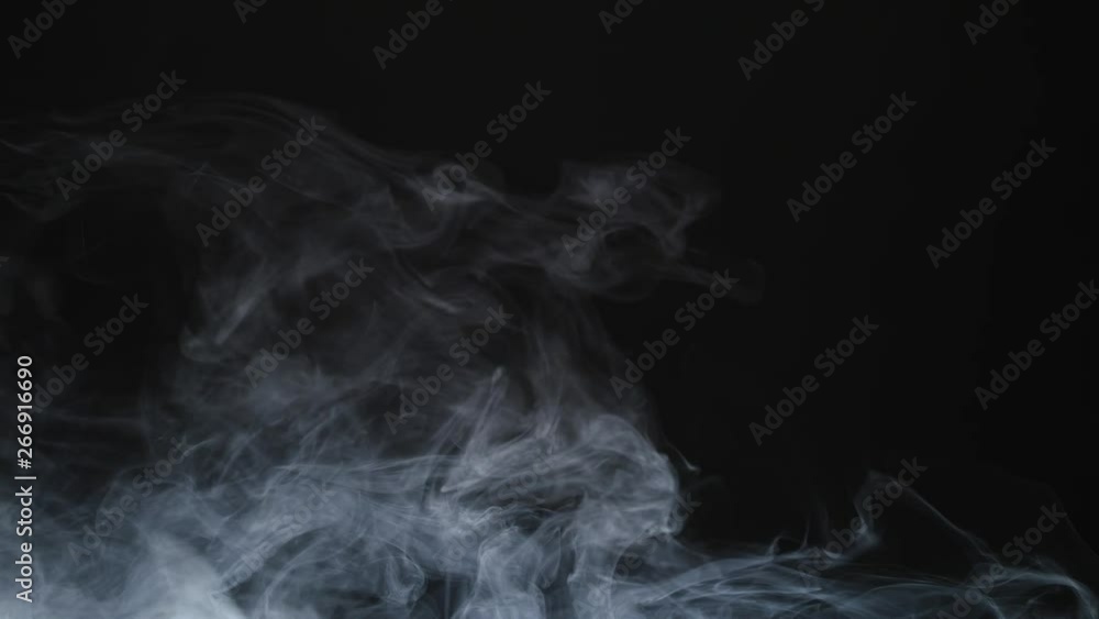 Smoke background. Abstract smoke cloud. Smoke in slow motion on black background. White smoke slowly floating through space against black background. Smoke effect. Fog effect. Smoke machine Smoke background. Abstract smoke cloud. Smoke in slow motion on black background. White smoke slowly floating through space against black background. Smoke effect. Fog effect. Smoke machine