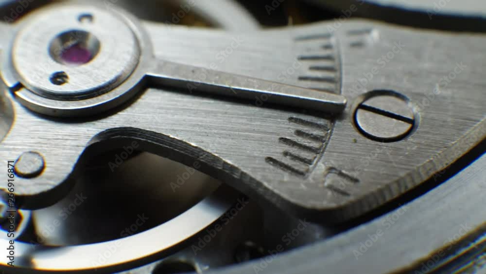 Cog wheels in clockwork old mechanical watch works. Time or work concept