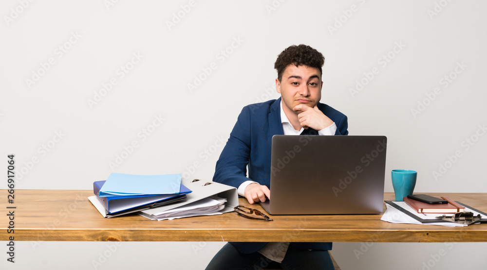 Business man in a office thinking Business man in a office thinking