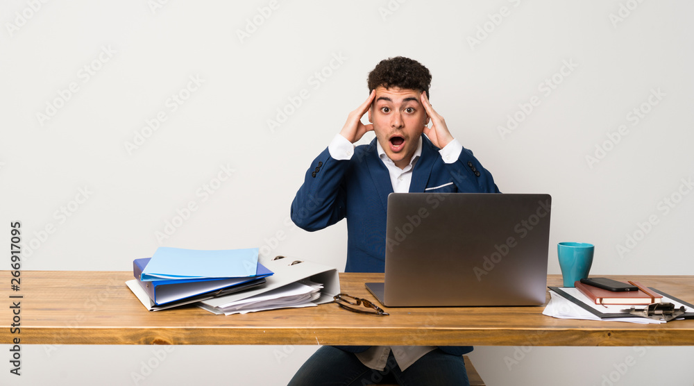 Business man in a office with surprise expression Business man in a office with surprise expression