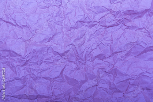 Old crumpled paper with wrinckles in purple color. Abstract background and texture for design