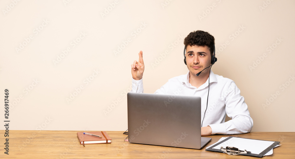 Telemarketer man with fingers crossing and wishing the best Telemarketer man with fingers crossing and wishing the best