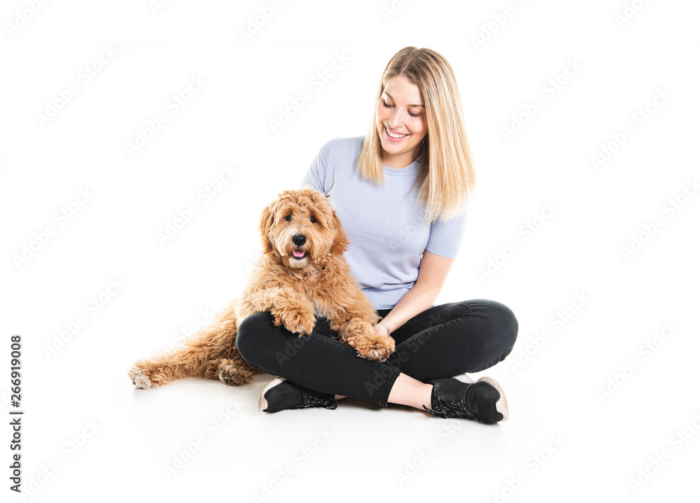 woman with his Golden Labradoodle dog isolated on white background woman with his Golden Labradoodle dog isolated on white background