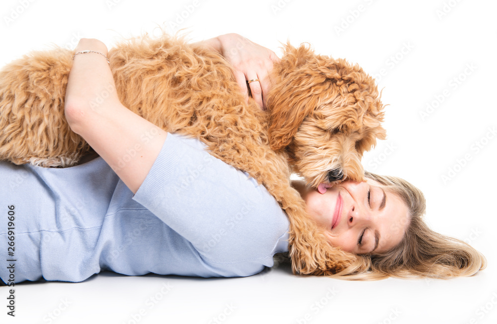woman with his Golden Labradoodle dog isolated on white background woman with his Golden Labradoodle dog isolated on white background