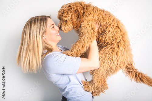 Canvas Print woman with his Golden Labradoodle dog isolated on white background