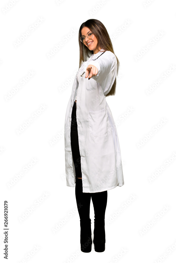 Full body of Young doctor woman points finger at you with a confident expression Full body of Young doctor woman points finger at you with a confident expression