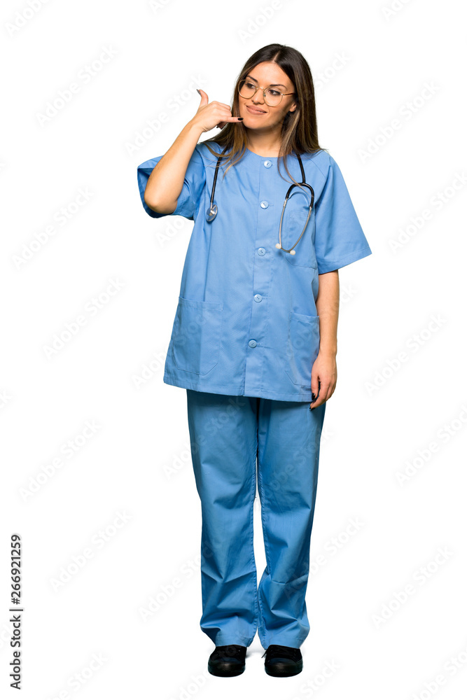 Full body of Young nurse making phone gesture. Call me back sign Full body of Young nurse making phone gesture. Call me back sign