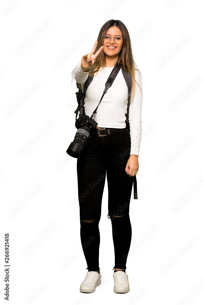 Full body of Young photographer woman smiling and showing victory sign Full body of Young photographer woman smiling and showing victory sign