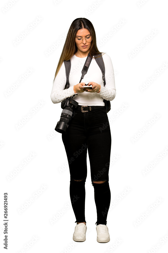 Full body of Young photographer woman using mobile phone Full body of Young photographer woman using mobile phone