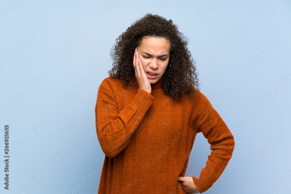Dominican woman with curly hair with toothache Dominican woman with curly hair with toothache
