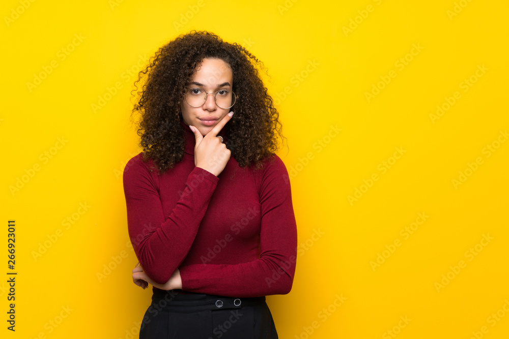 Dominican woman with turtleneck sweater looking to the front Dominican woman with turtleneck sweater looking to the front
