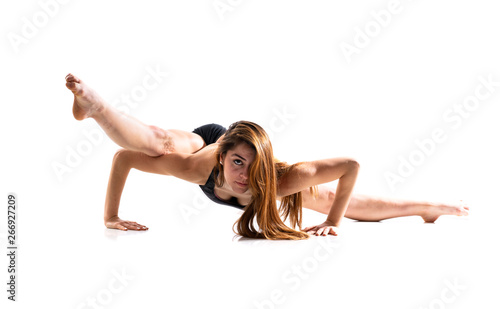 Young dance girl over isolated white background .