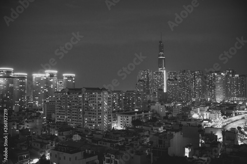 Ho Chi Minh City, Vietnam view at night on a new modern buildings and hotels and Financial Tower and skyscrapers background black and white