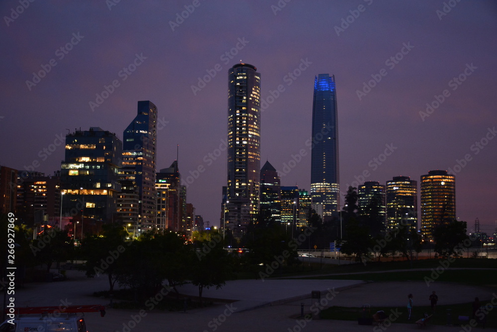 Naklejka premium Sunset, architecture and city lights in Santiago, Chile