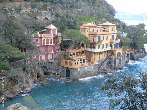 PORTOFINO , ITALY - MAY 02, 2019: The beautiful Portofino with colorful houses and villas, luxury yachts and boats in little bay harbor. Liguria, Italy, Europe