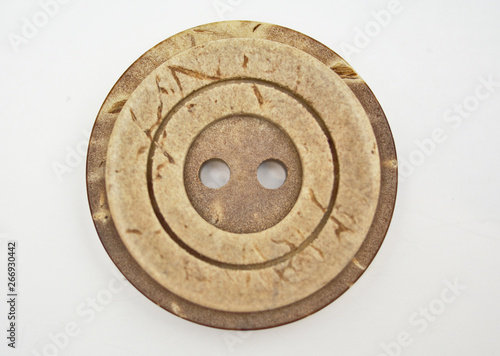 One brown round button isolated on white background.