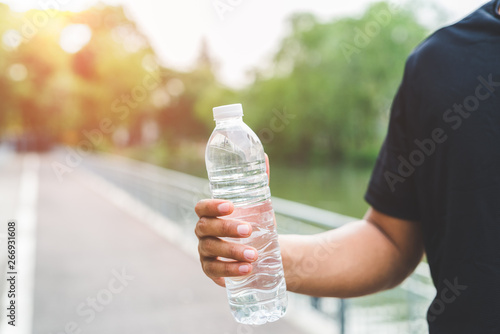 Man holding bottle of water