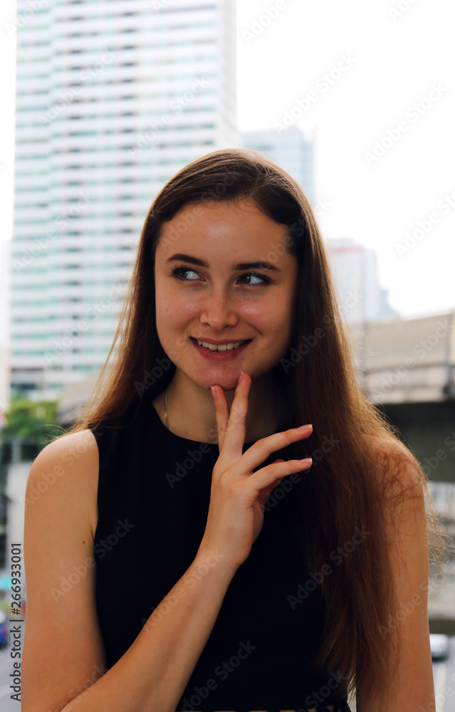 Close-up Beautiful woman smile portrait and office building background. Close-up Beautiful woman smile portrait and office building background.