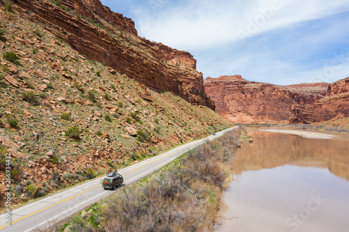 Obraz na płótnie Fruita, Colorado, USA April 8, 2019: Vanagon Camper van driving towards the mountains loaded with mountain bikes w salonie