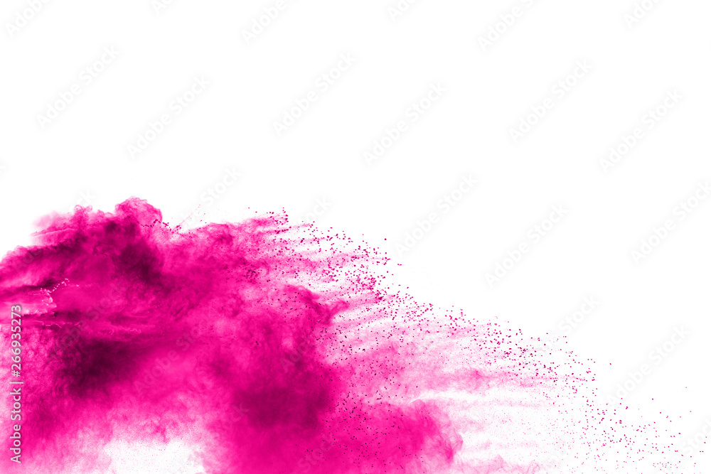 Pink powder explosion on white background.Pink dust particles splash.