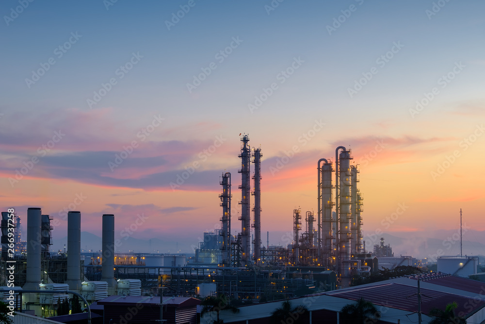 Oil and gas refinery plant or petrochemical industry on sky sunset background, Factory at evening, Manufacturing of petroleum industrial plant