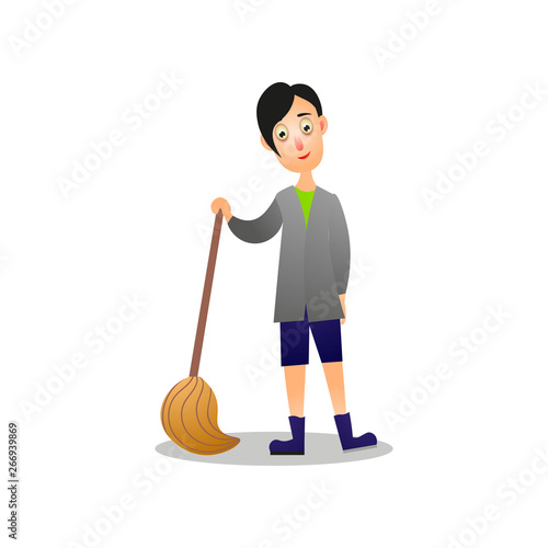 Cute young boy cleaning home floor using broom