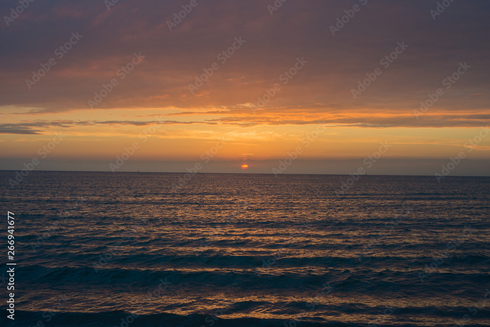 Fototapeta premium Beautiful sunset over the sea. Bright sunset sky with clouds. Black sea, Anapa, Krasnodar region, Russia