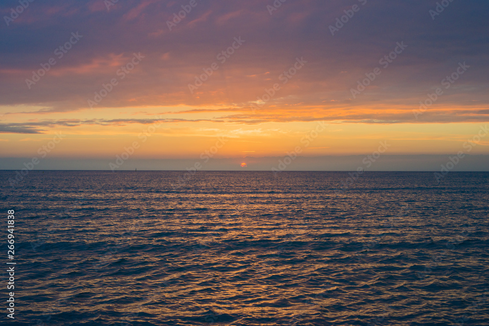 Fototapeta premium Beautiful sunset over the sea. Bright sunset sky with clouds. Black sea, Anapa, Krasnodar region, Russia
