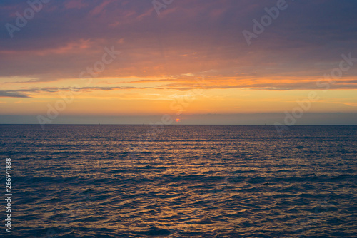 Beautiful sunset over the sea. Bright sunset sky with clouds. Black sea, Anapa, Krasnodar region, Russia