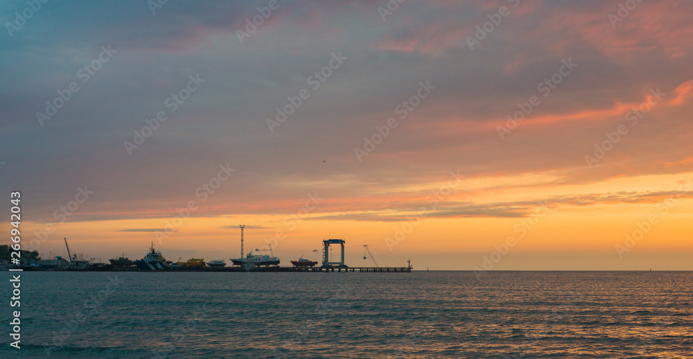 Beautiful sunset over the sea. Bright sunset sky with clouds. Black sea, Anapa, Krasnodar region, Russia Beautiful sunset over the sea. Bright sunset sky with clouds. Black sea, Anapa, Krasnodar region, Russia