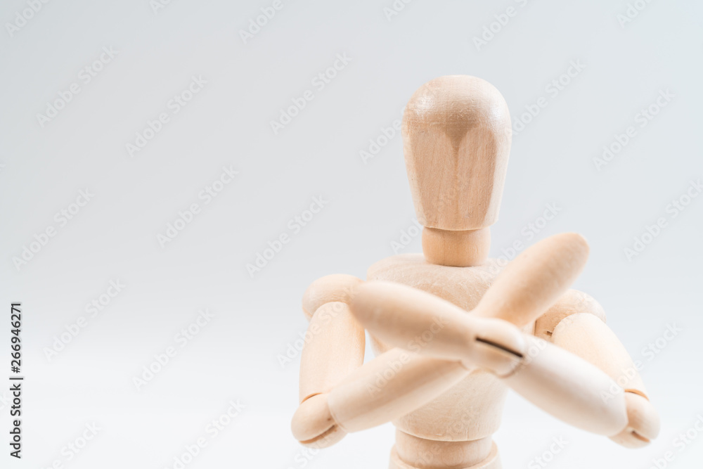 Refusal gesture, Wooden dummy, crossed hands on white background, copy space for your object or text Refusal gesture, Wooden dummy, crossed hands on white background, copy space for your object or text