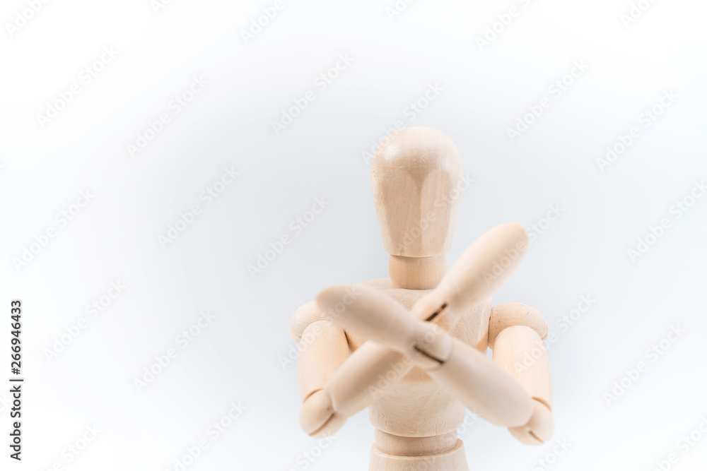 Refusal gesture, Wooden dummy, crossed hands on white background, copy space for your object or text Refusal gesture, Wooden dummy, crossed hands on white background, copy space for your object or text