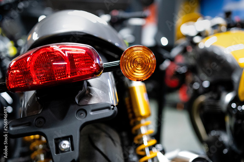 Close up of the rear of a brand new clasic motorcycle, soft focus, abstract background - Image photo