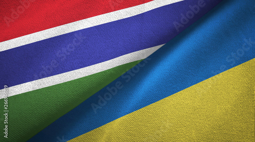 Gambia and Ukraine two flags textile cloth, fabric texture