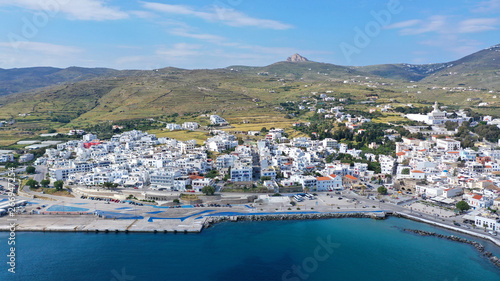 Aerial drone photo of iconic main town and port of Tinos island featuring monastery of Panagia Megalochari (Virgin Mary), Cyclades, Greece © aerial-drone